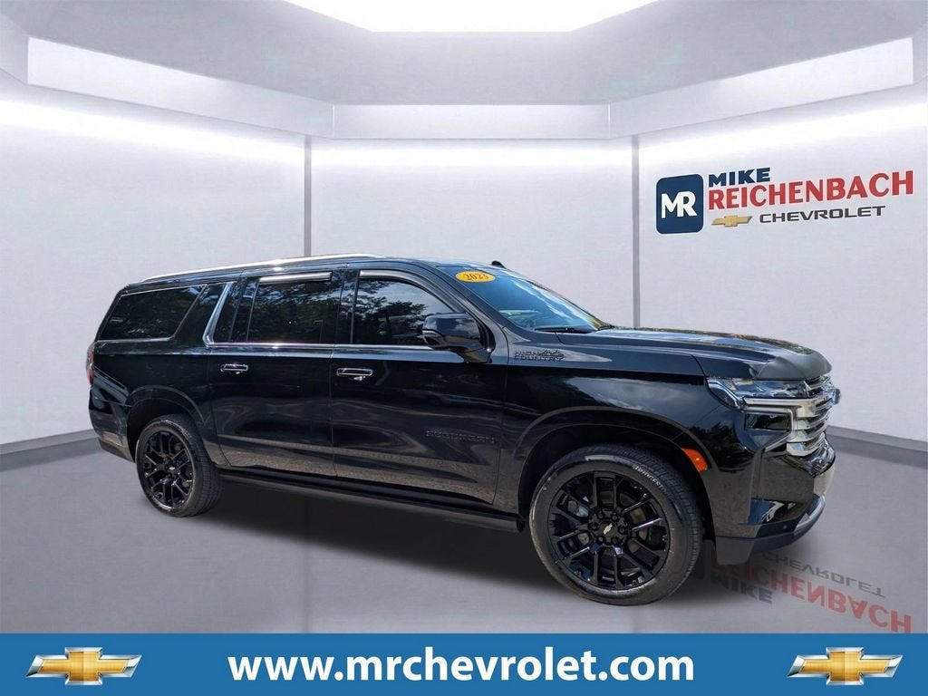 2023 Chevrolet Suburban High Country in Black — front three-quarter view