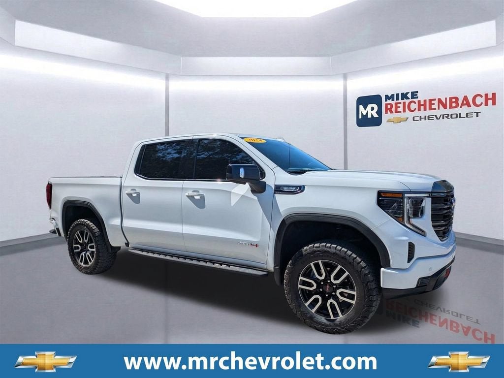 2024 GMC Sierra 1500 AT4 in Summit White — front three-quarter view